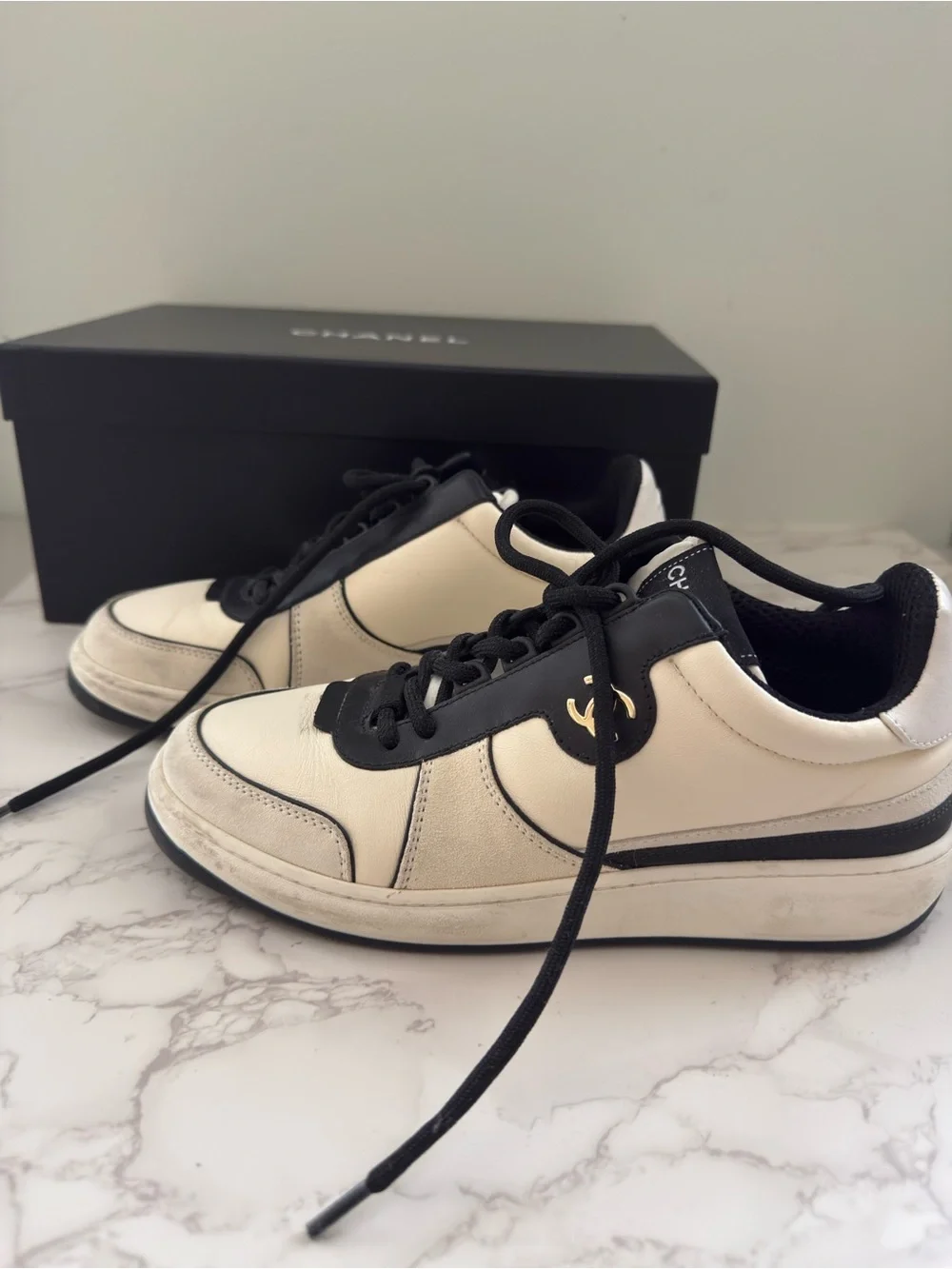 CHANEL Leather Cream and Black CC Charm Low-Top Sneakers